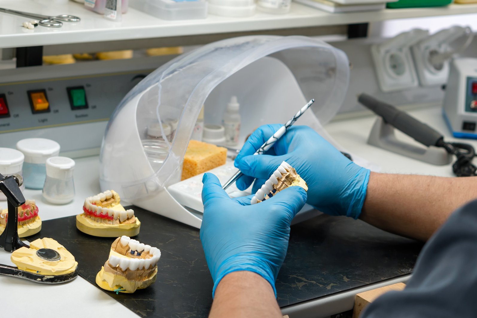 Dental Prosthesis Work. Teeth Painting.